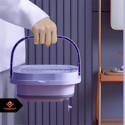 Mini washing machine by Rabiya Team, compact appliance with a door, control panel, and drum for small laundry loads.
